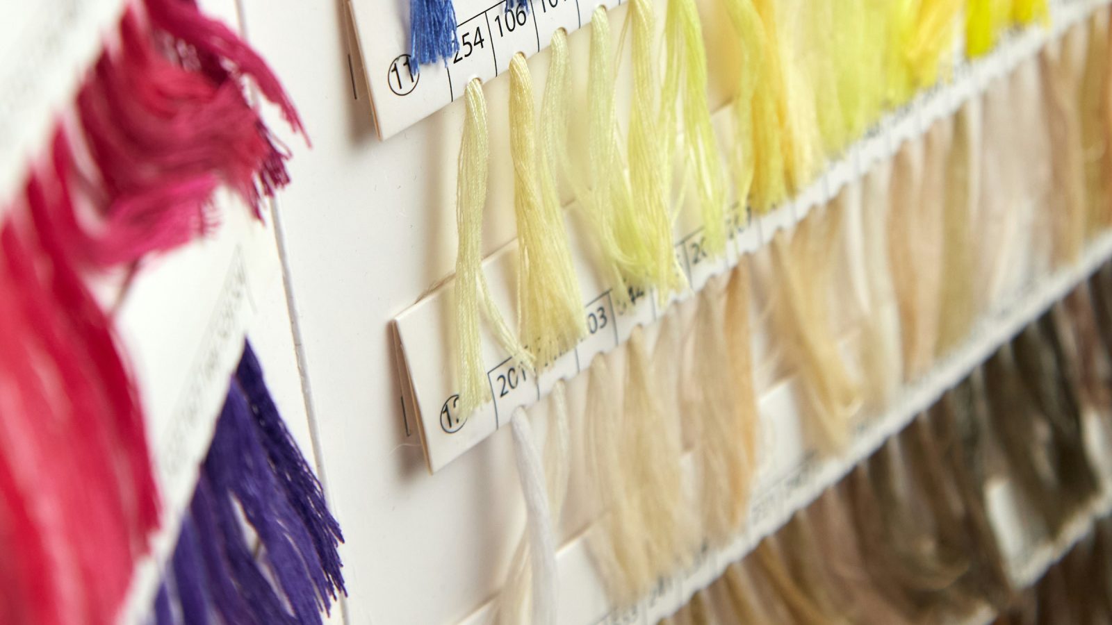 Rows of hair color swatches in yellow, blonde, beige and light brown shades