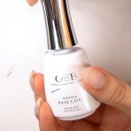 OBB Gel Adhesive Base Coat bottle in hand